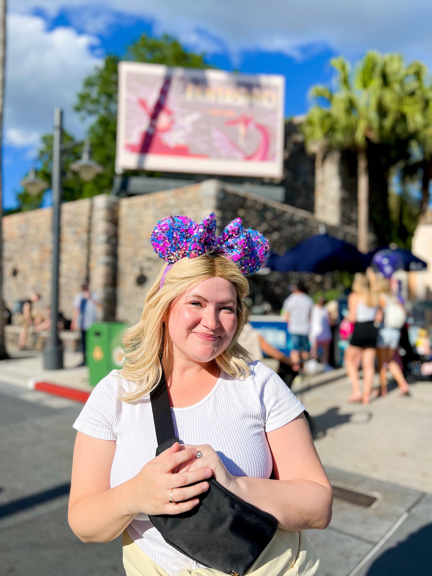 A person wearing purple sequin mouse ears in Hollywood Studios.