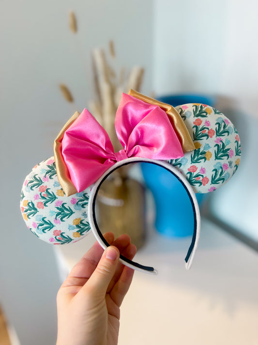 A pair tulip floral pattern mouse ears and a pink and yellow silky bow
