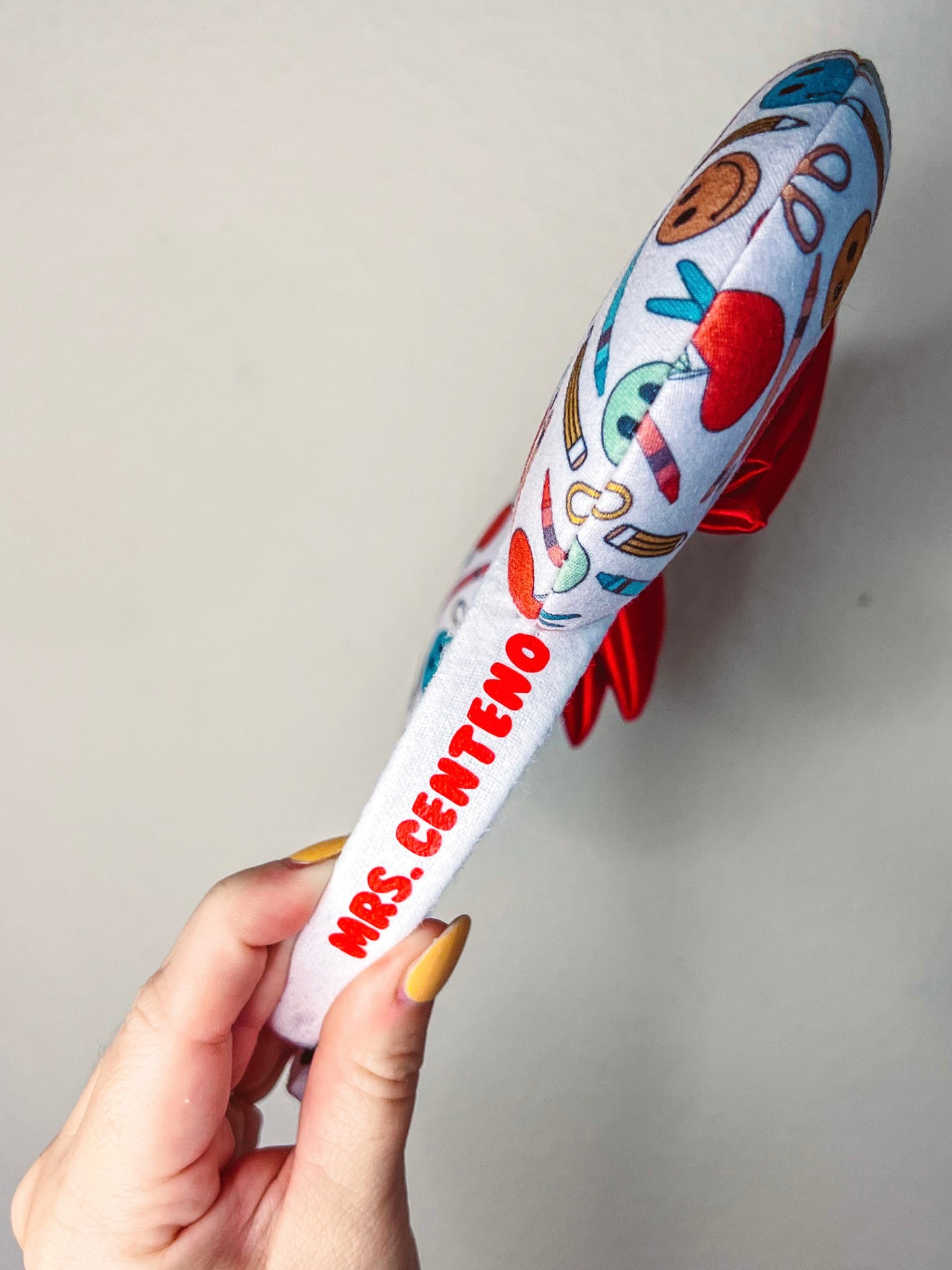 The same ears as before but it’s the side view showing the customization in red bubble font